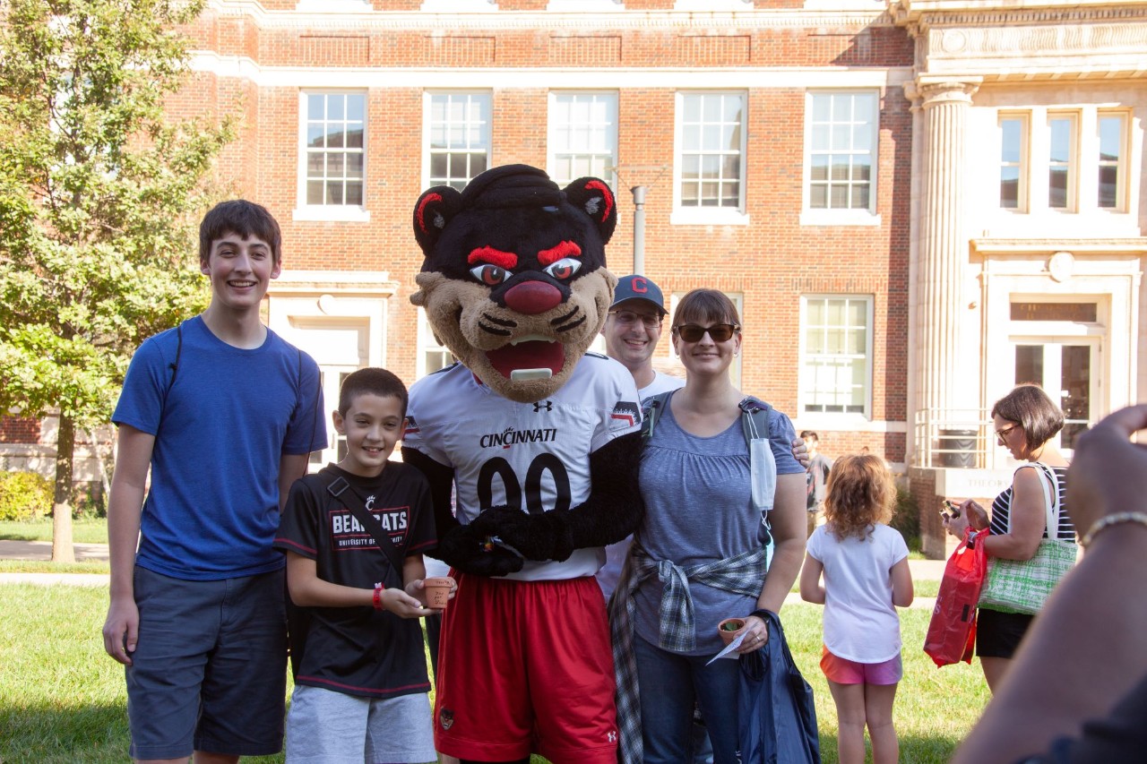 Family posing with the UC Bearcat mascot