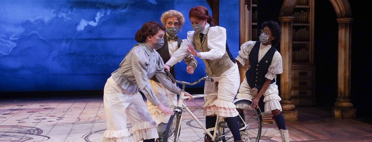 A photo of actors on stage during CCM's production of Blue Stockings