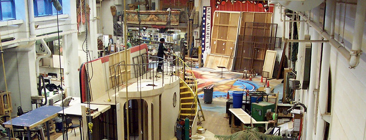 A photograph of students, faculty and staff members building sets in CCM's 8,500 square foot Scene Shop.