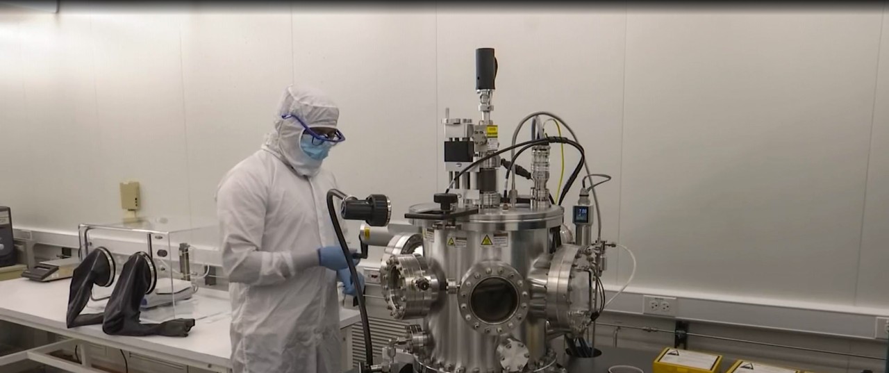 A UC student works in a clean room.