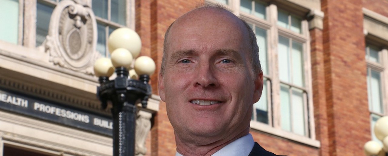 Dr. Thomas Herzog in front of building