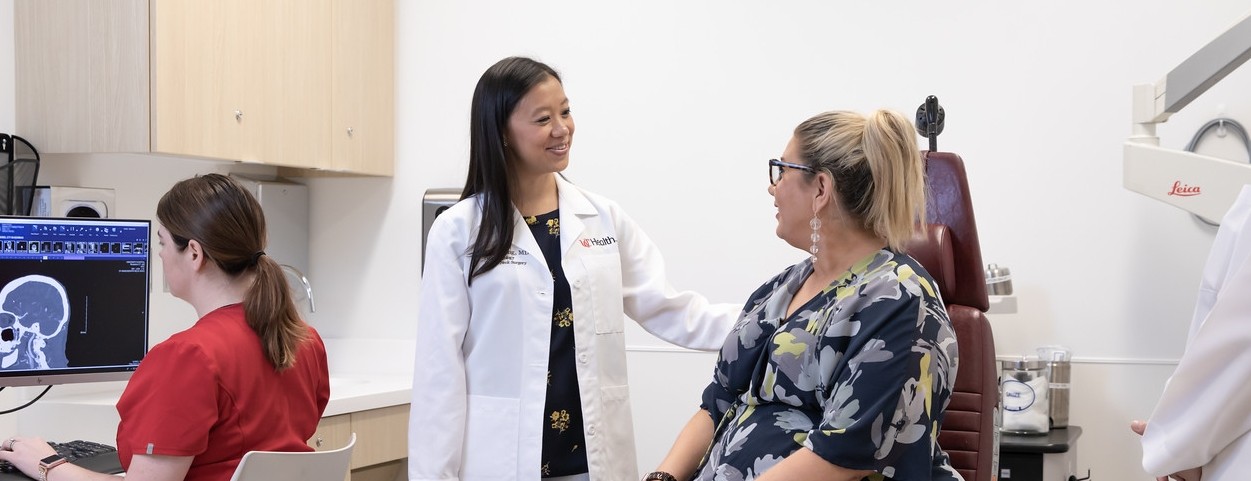 Alice Tang, MD, talks with a patient