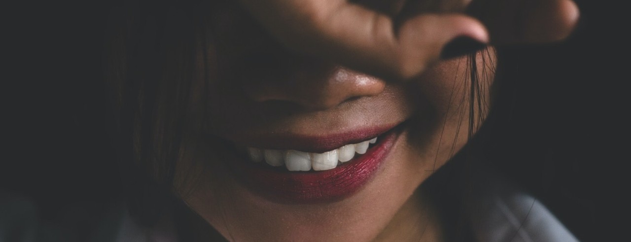 Woman smiling.