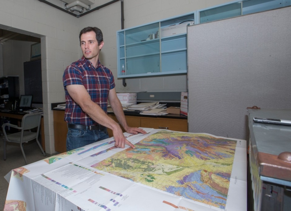 Daniel Sturmer, UC geology professor shown here in his at office and lab at Geo-Phys. UC/ Joseph Fuqua II 