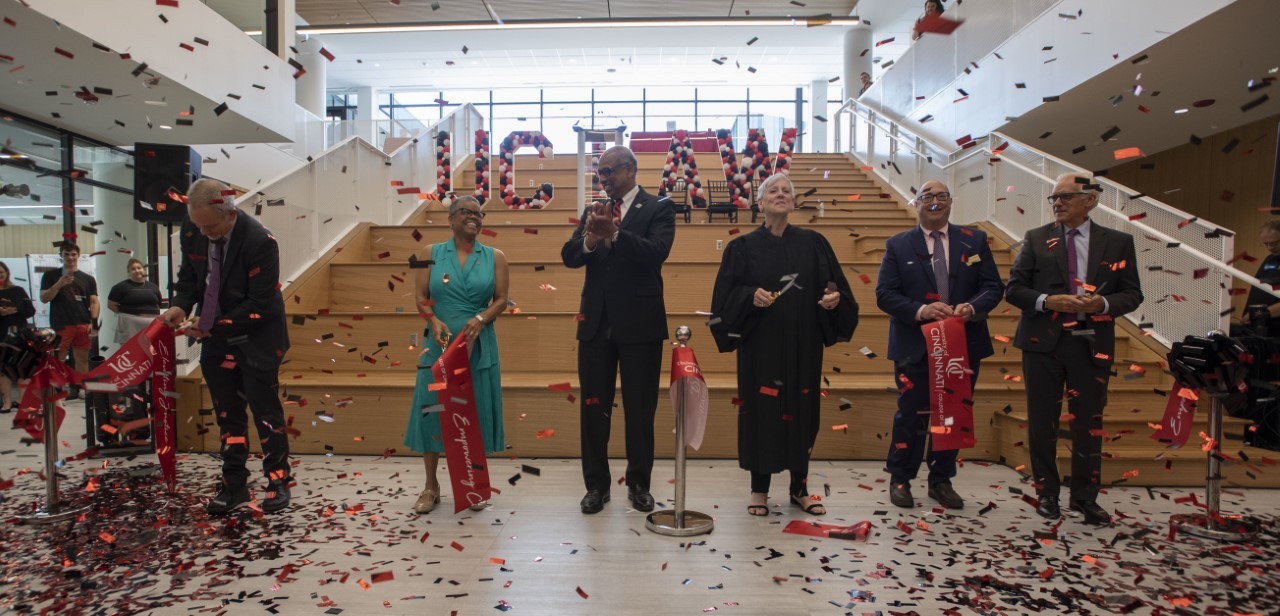 UC Law Dean Verna Williams joined by UC President Neville Pinto and others for a ribbon cutting