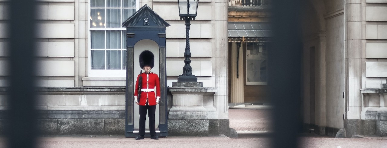 Buckingham palace with a guard outside