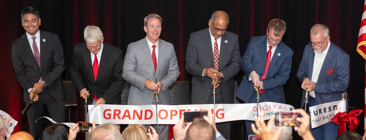 From left, Cincinnati Mayor Aftab Pureval, chancellor of the Ohio Department of Higher Education Randy Gardner, Ohio Lt. Gov. Jon Husted, UC President Neville G. Pinto, UC Chief Innovation Officer Ryan Hays and UC Vice President for Research Patrick A. Limbach cut the ribbon at the Digital Futures grand opening.