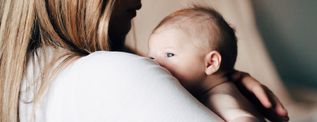 a woman holding a baby