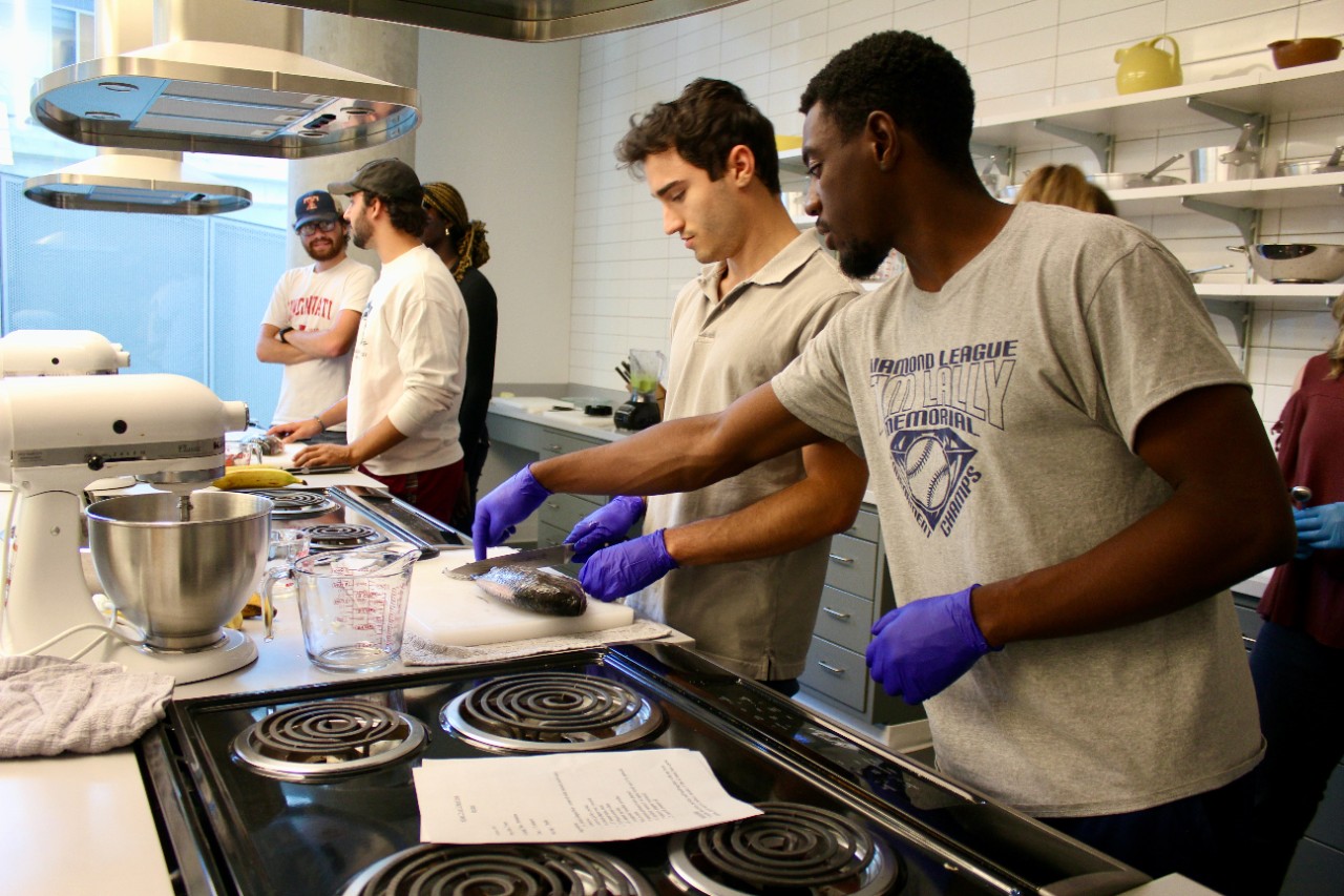 students cooking in food lab