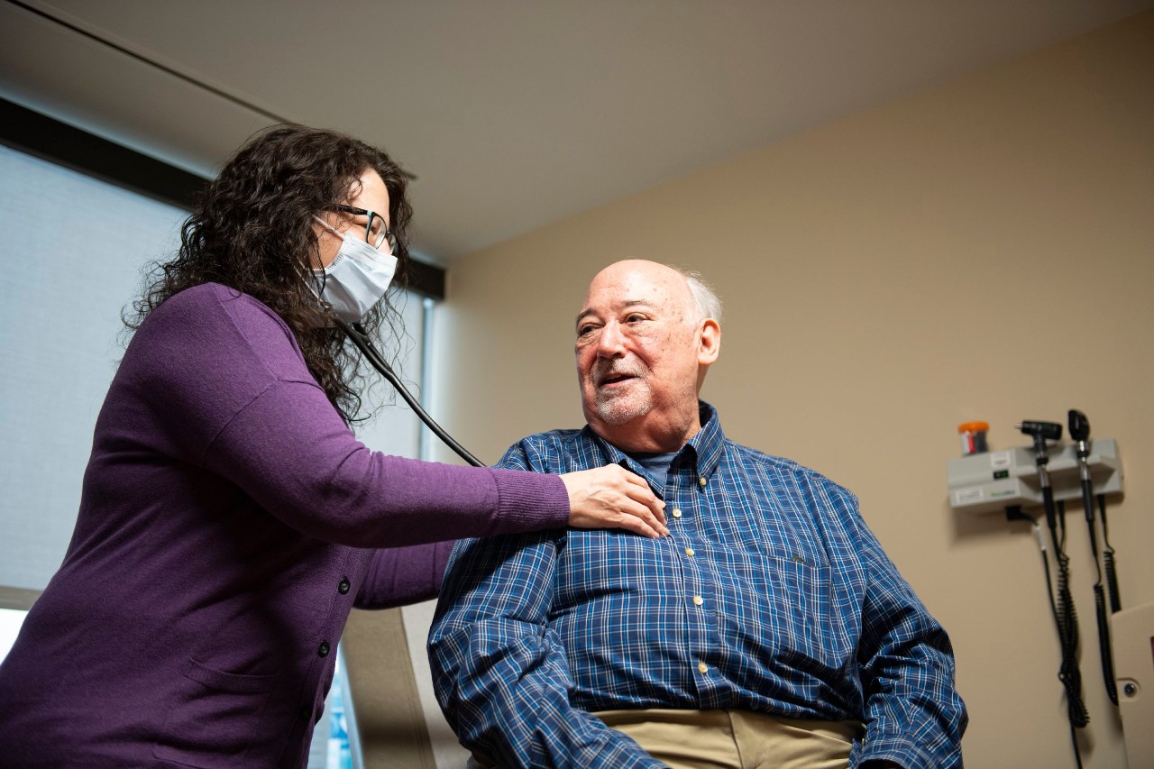 a doctor examines a patient