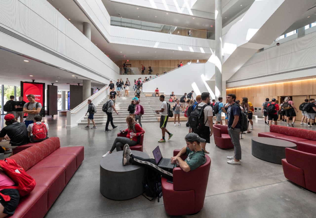 Students walk around the atrium of Lindner Hall.