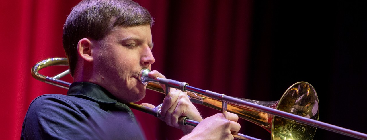 A CCM student plays a trombone during a Jazz Orchestra concert.
