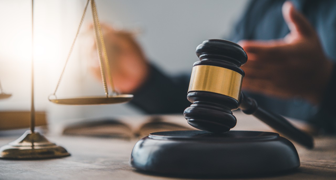Law theme, mallet of the judge, law enforcement officers, evidence-based cases and documents taken into account.