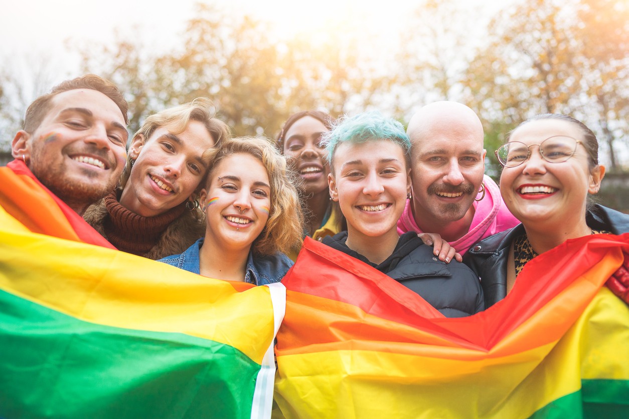 LGBTQ friends smiling in group photo