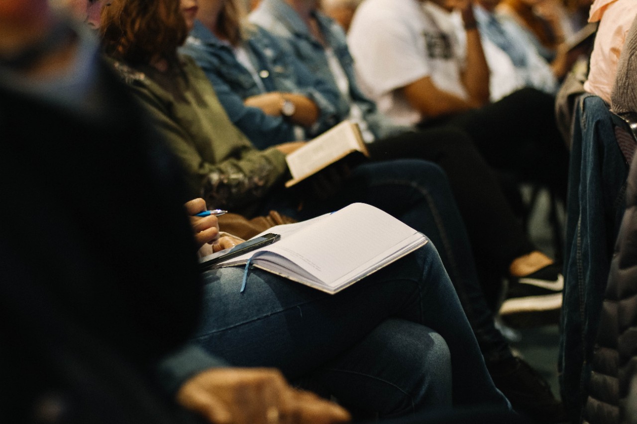 Image of students crowded into a lecture hall.