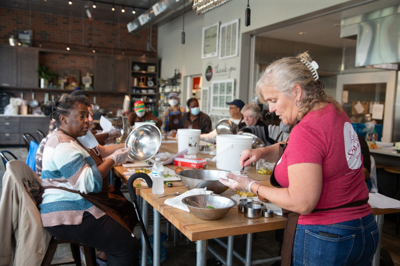 People being instructed at a cooking class