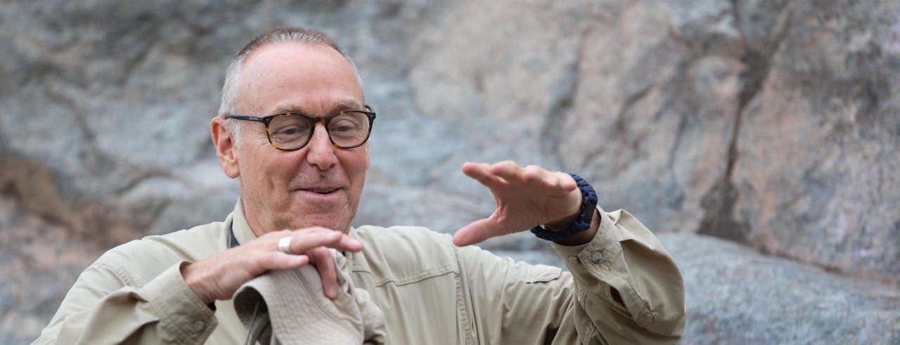 Craig Dietsch gestures while talking about the geology of a formation.