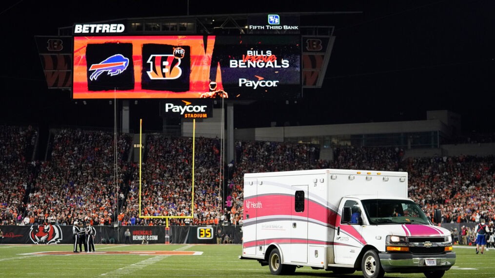 An ambulance leaves a football field