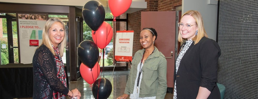 UC Blue Ash College faculty and staff at table during open house event