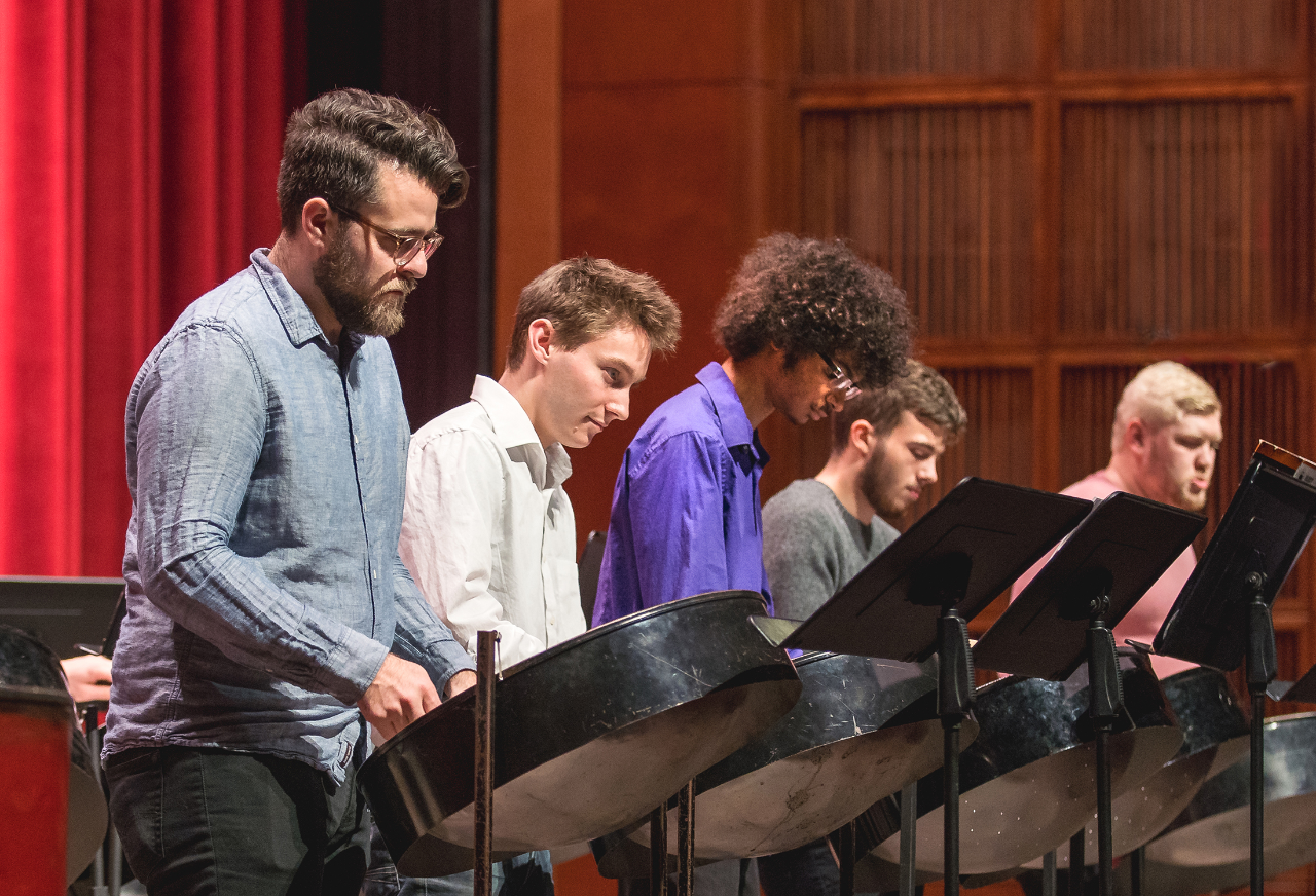 Students perform in the CCM Steel Drum Band on the Corbett Auditorium stage. Photo/UC Creative + Brand