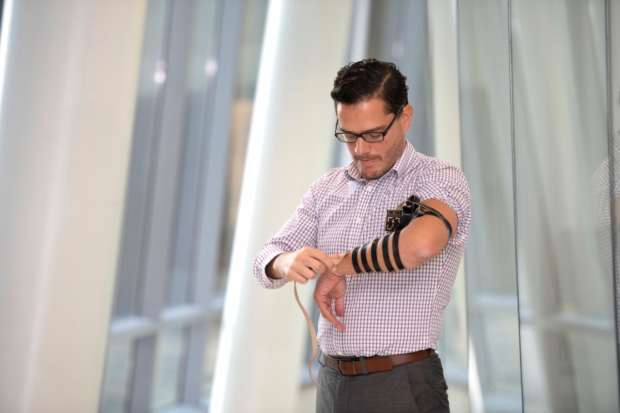 Jack Rubinstein, MD, of the Division of Cardiovascular Health wearing a tefillin arm wrap