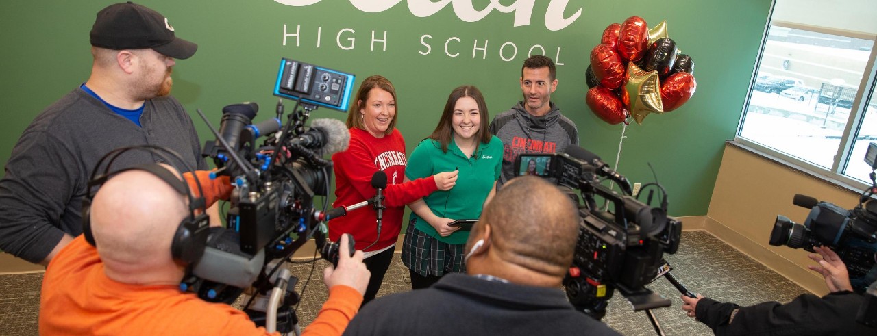 Anna Horgan shown with her parents Jen and Tim Horgan at Seton High School in Cincinnati on Decision Day 2023.
