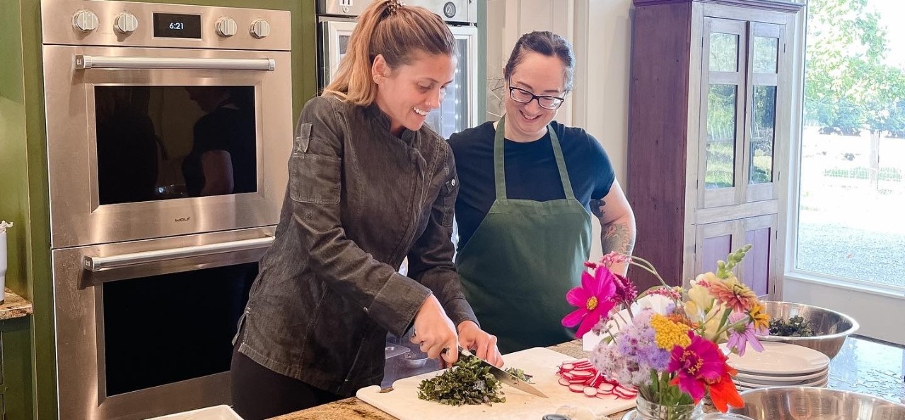 two people prepping a healthy meal