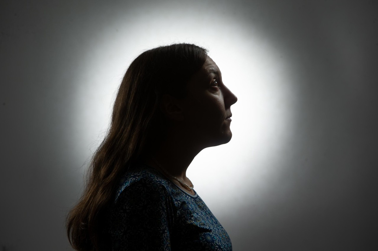 A photo illustration of Nese Devenot in a halo of light.