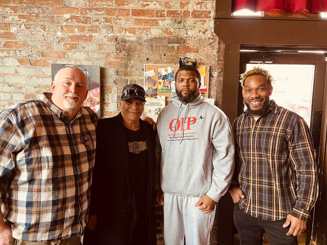 Marcus Sapp in the grey sweatshirt, supported by fellow OIP clients, from left, Dean Gillispie, Robert McClendon and Christopher Smith.