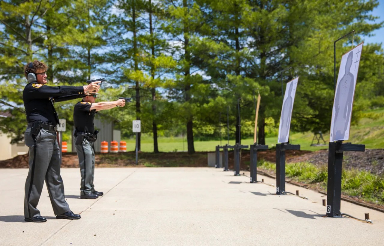 a photo of police at a gun firing range