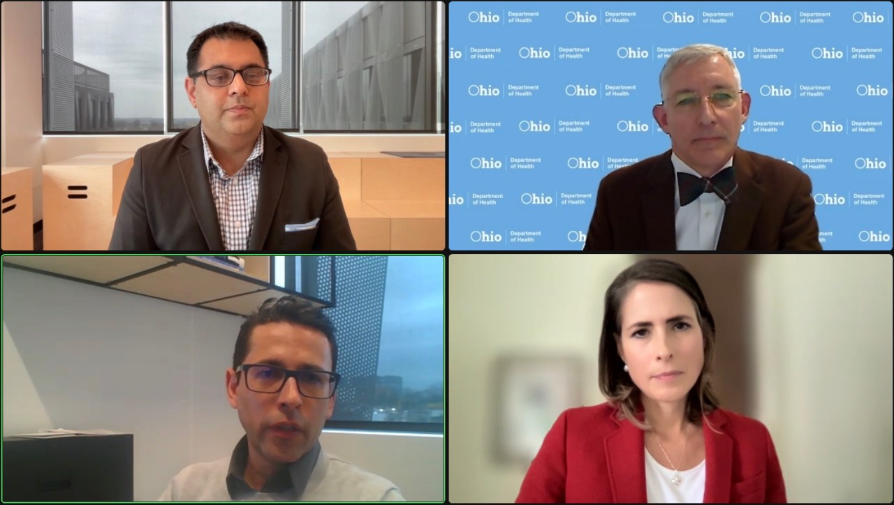 Four people have a conversation during an event hosted on Zoom.