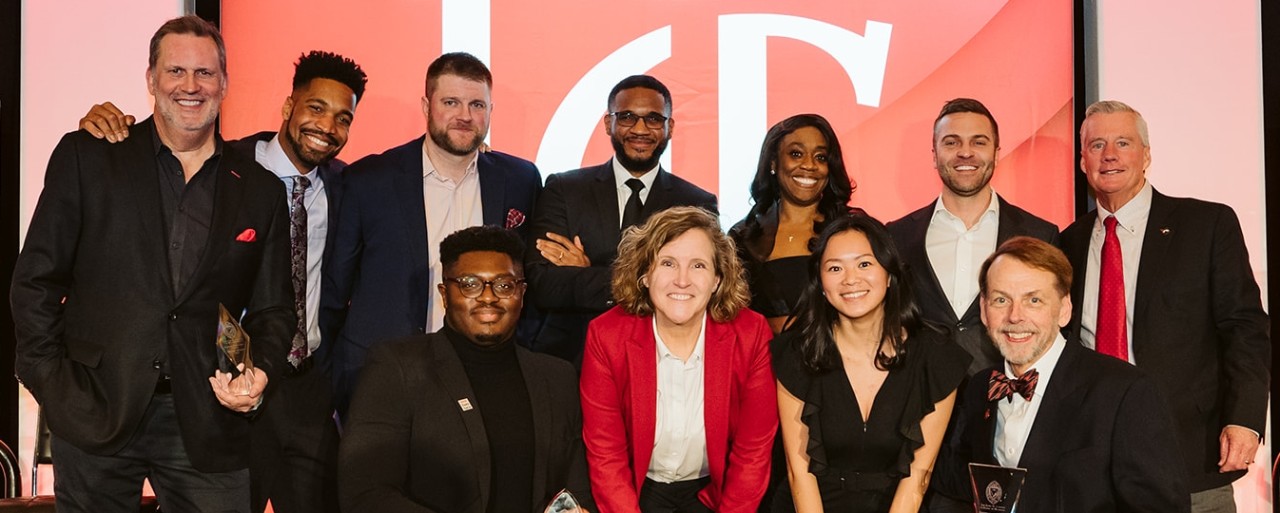 Awardees and honorees at the 2023 Cincinnati Business Achievement Awards pose with Lindner Dean Marianne Lewis.