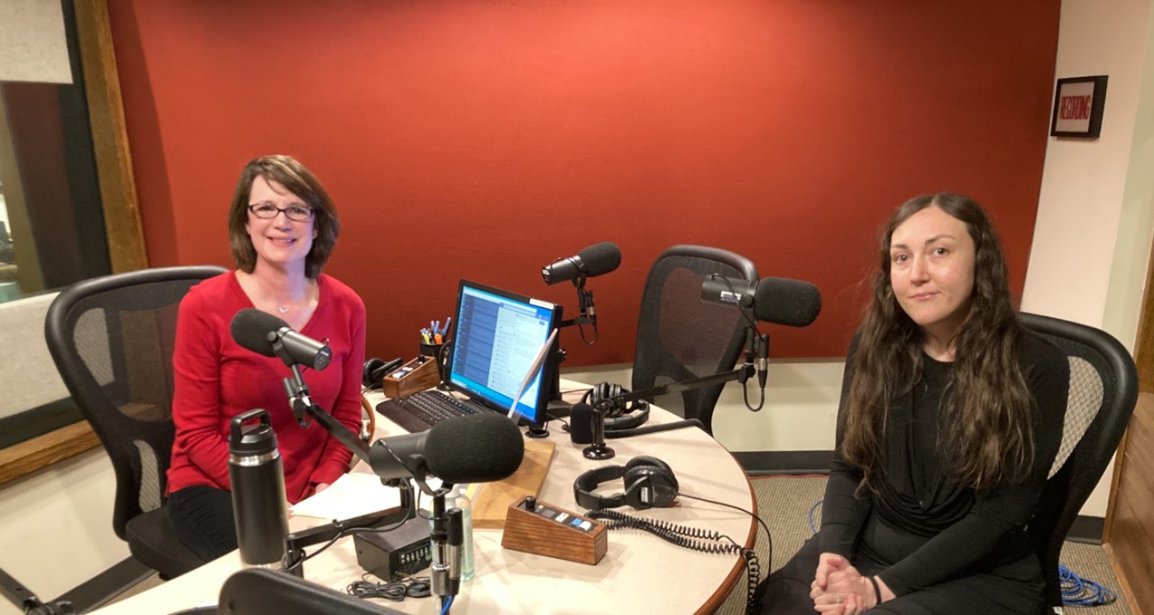 WVXU host Lucy May and UC research associate Nese Devenot sit in the WVXU radio studio.