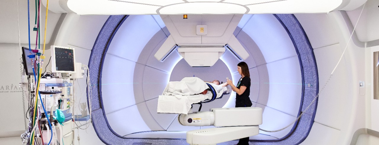 A mock patient at the Proton Therapy Center gantry