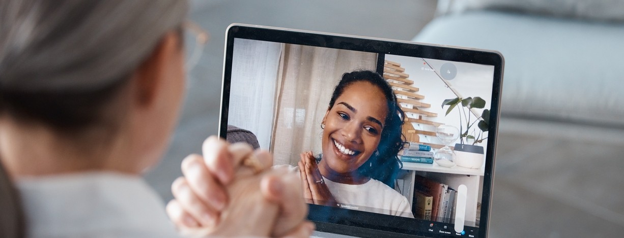 A therapist and patient talk on a video call