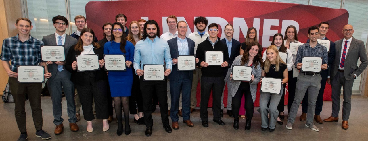 Lindner students stand with their award plaques.