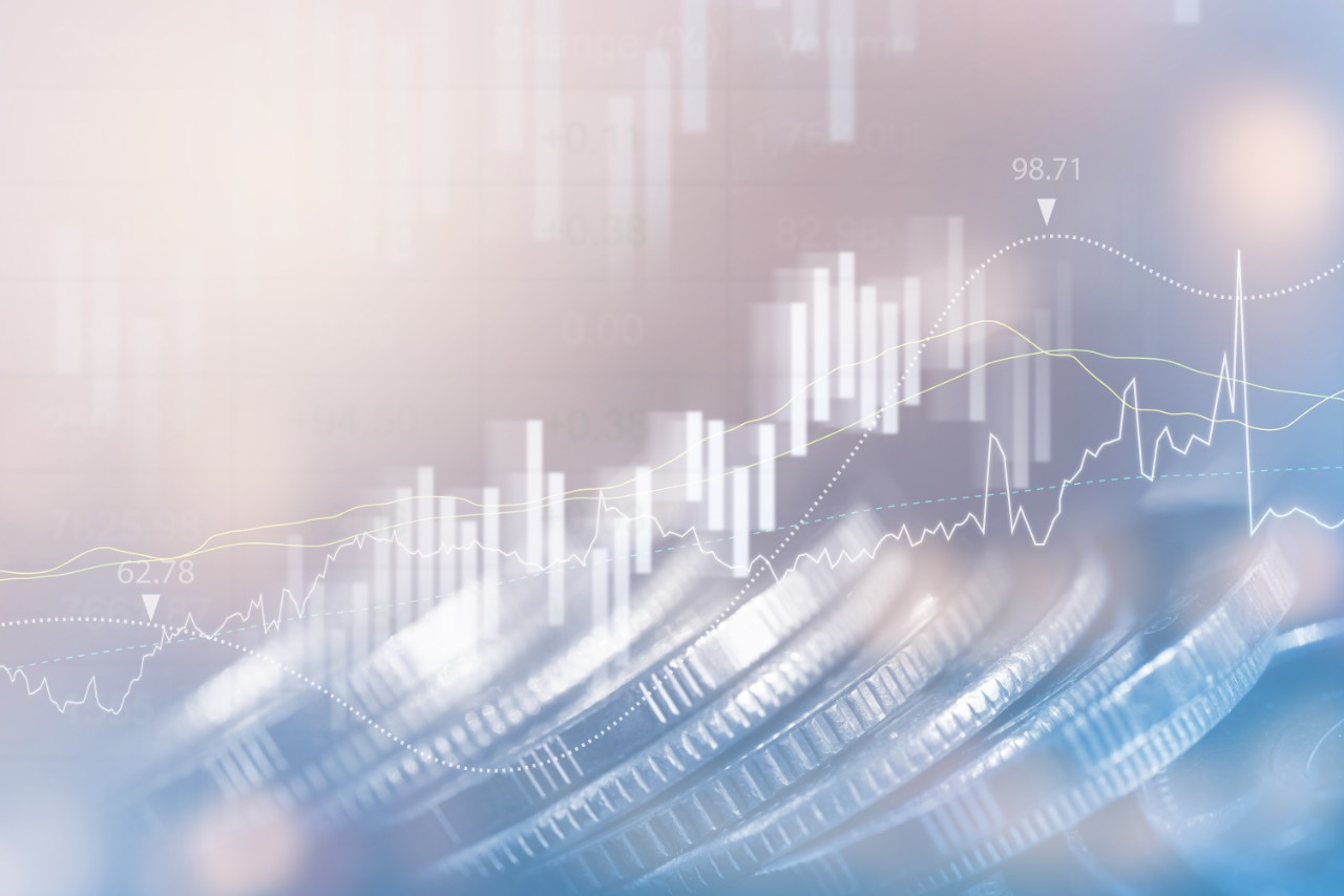 Finance and business backgrounds concept. Double exposure of Stock market report, financial graph and row of coins with copy space