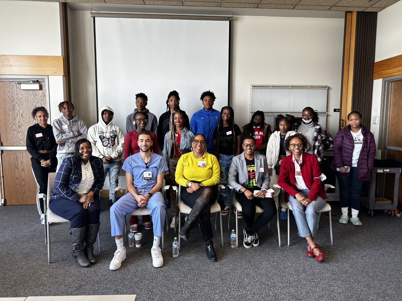 UC Nursing Alumni Council leaders Deasa Dorsey and Felicia Beckham with a group of Cincinnati Public Schools students