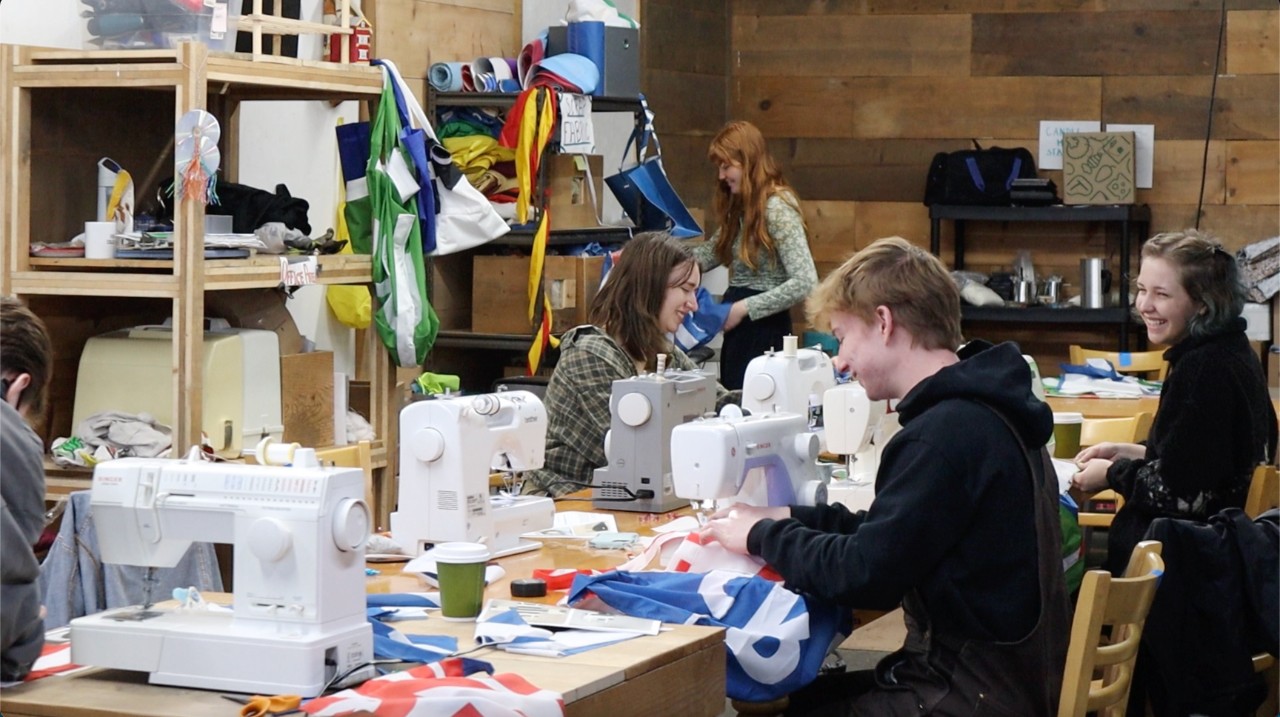 Nicole Perozek, Caroline Bussick, Hannah Weisburn and Michael Werst participate in a Makerspace tote bag sewing workshop. 