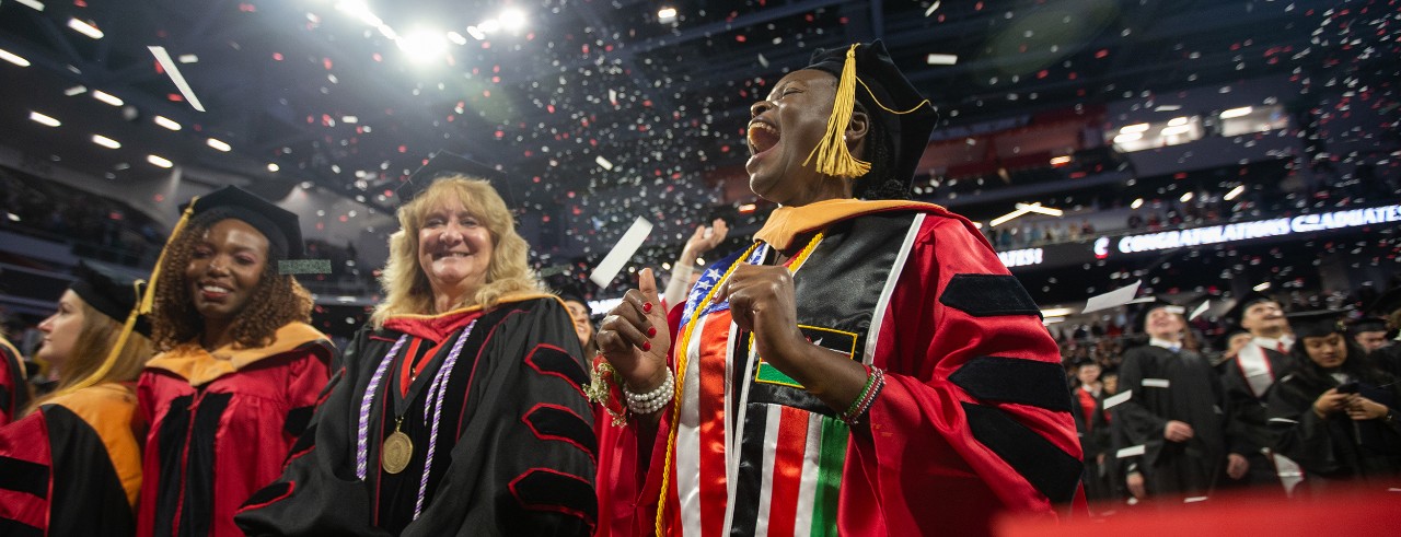 Graduates celebrate the finale of commencement as confetti falls from the rafters of Fifth Third Arena.