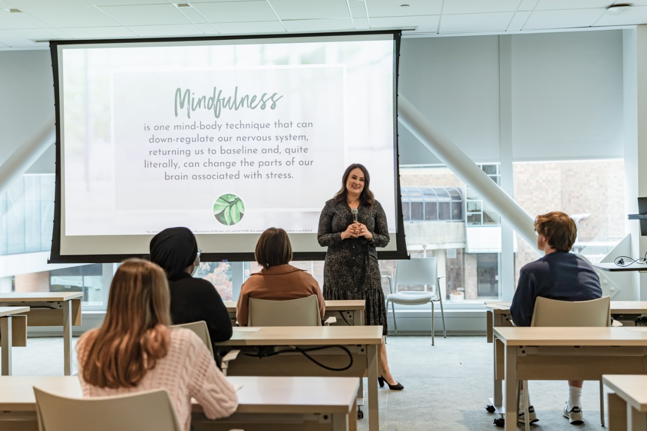 Meriden McGraw conducts mindfulness training session.