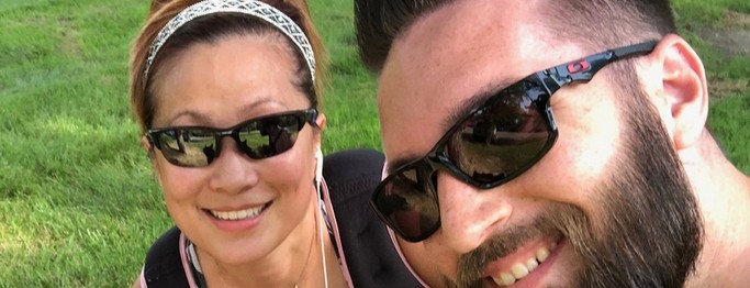 Lauralee and Kevin Wheat smile for a selfie while on a run