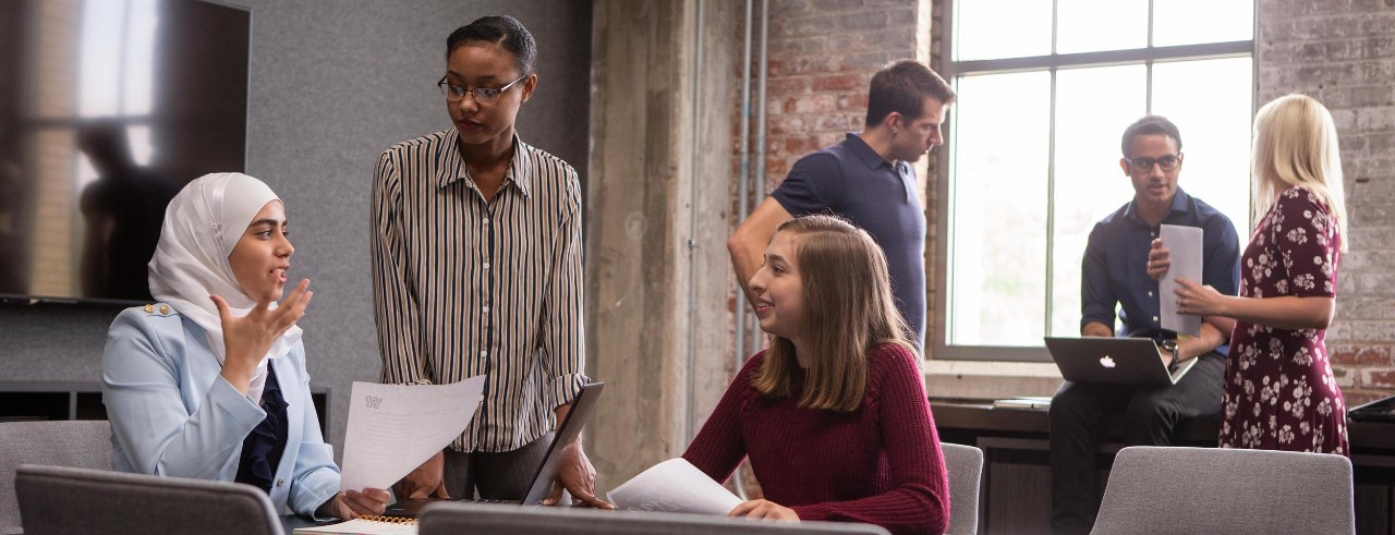 People work together in a conference room.