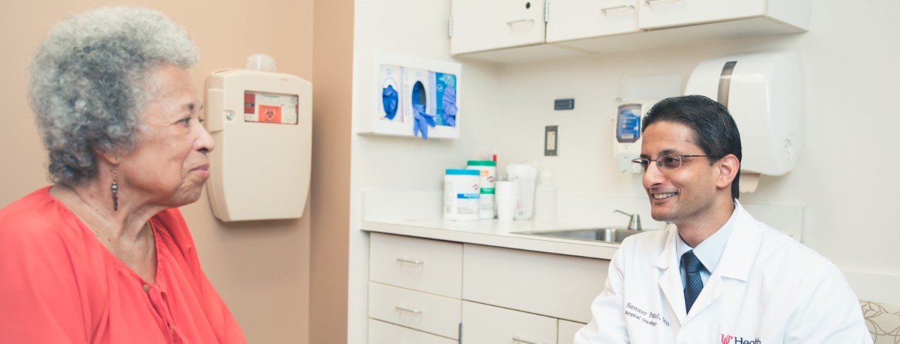 A patient talks with Dr. Patel in an exam room