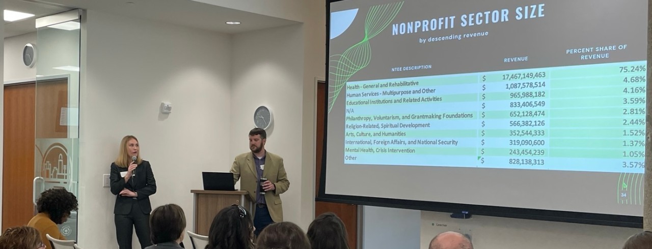 Annie Hugenberg, left, and Kautz-Uible Professor of Economics Michael Jones, PhD, present at the first session of the Better Together workshop series for local nonprofits.