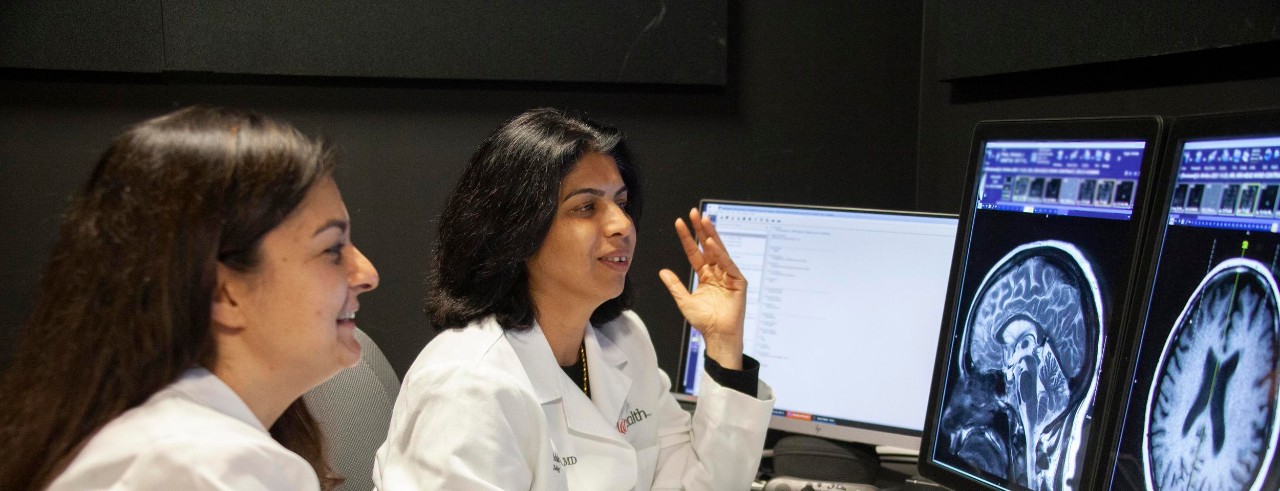 Drs. Khatri and Vagal review brain image data