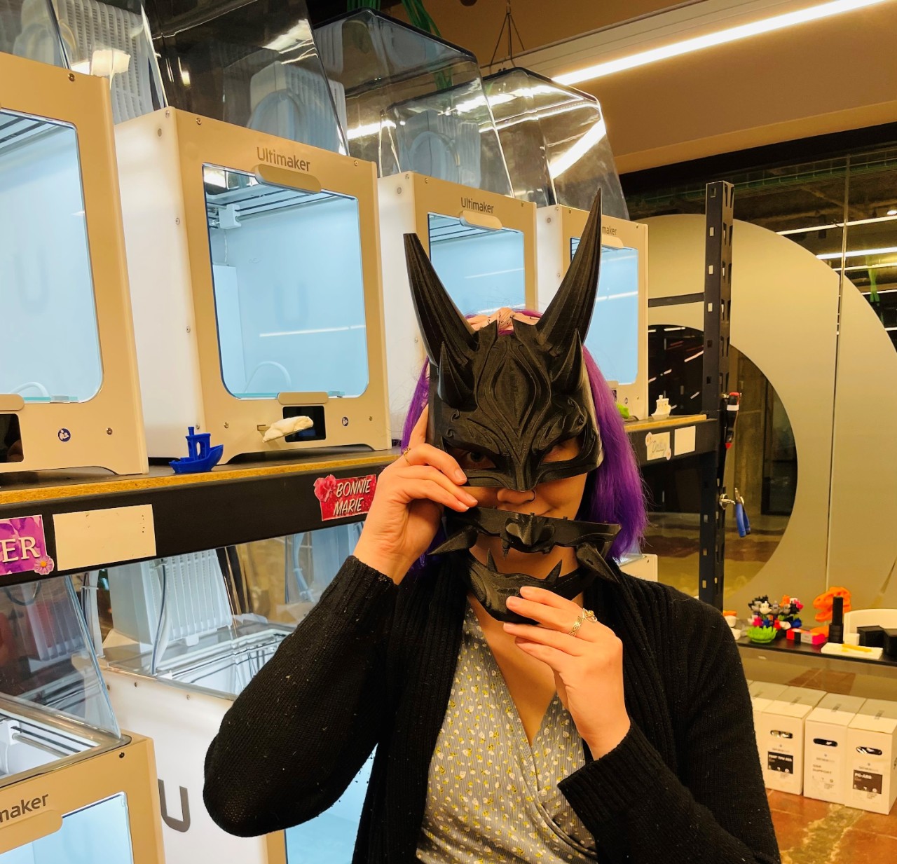 A UC student models a 3D printed cosplay mask.