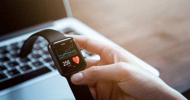 a photo of someone looking at a smartwatch