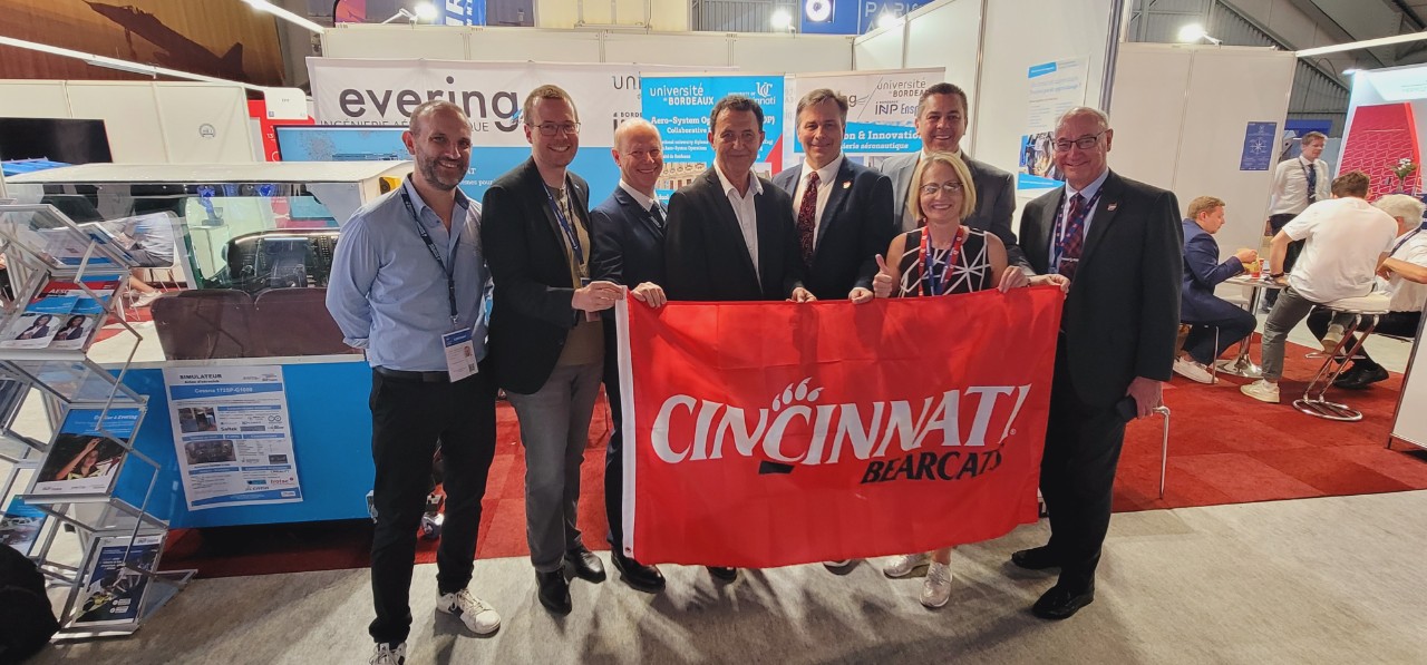 Leaders from UC and UBx celebrate the signing of a renewed agreement