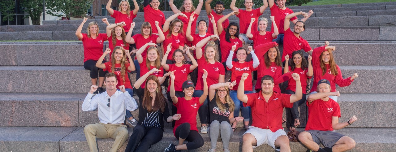 Group of students performing UC school cheer Down the Drive